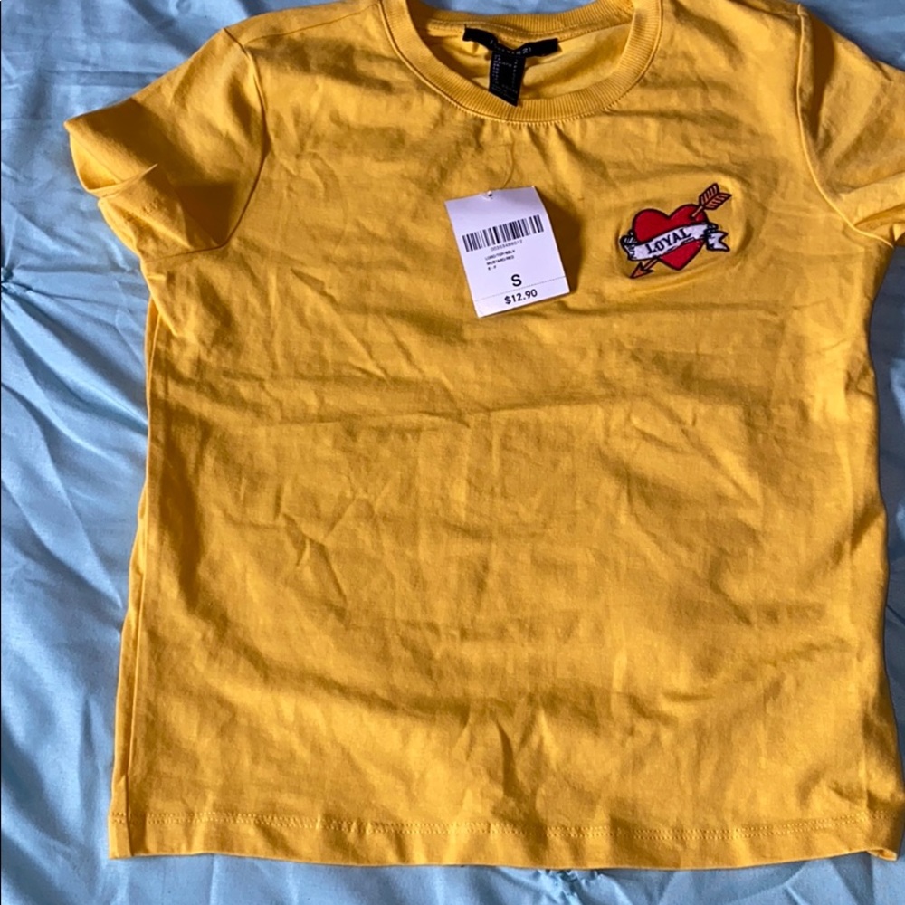Mustard shirt with heart on the right side